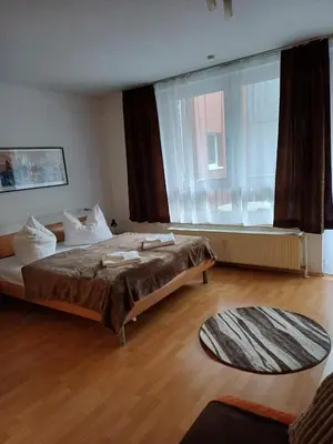 Ein Bett oder Betten in einem Zimmer der Unterkunft Business Apartment