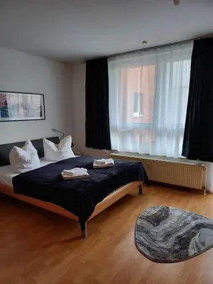 Ein Bett oder Betten in einem Zimmer der Unterkunft Business Apartment