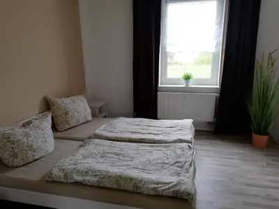 Ein Bett oder Betten in einem Zimmer der Unterkunft Ferienwohnung mit Seeblick