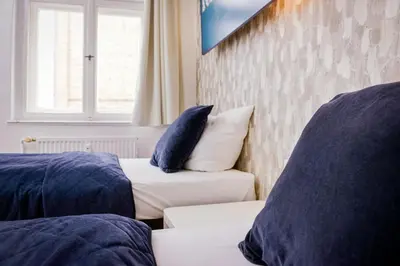 Ein Bett oder Betten in einem Zimmer der Unterkunft Old Town Hotel