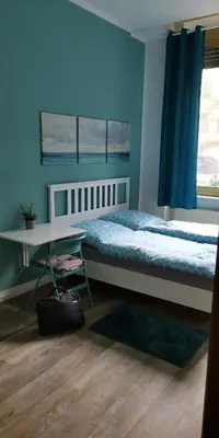 Ein Bett oder Betten in einem Zimmer der Unterkunft Pension Kaffeefreunde