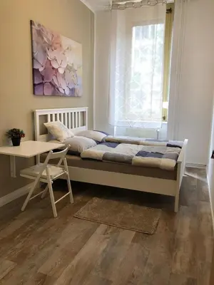 Ein Bett oder Betten in einem Zimmer der Unterkunft Pension Kaffeefreunde