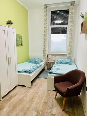 Ein Bett oder Betten in einem Zimmer der Unterkunft Pension Kaffeefreunde