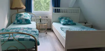 Ein Bett oder Betten in einem Zimmer der Unterkunft Zwei Etagen Wohnung im Grünen