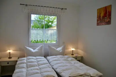 Ein Bett oder Betten in einem Zimmer der Unterkunft Ferienhaus Berlin