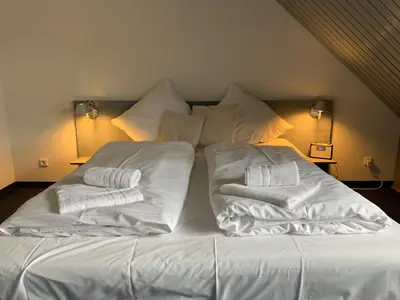 Ein Bett oder Betten in einem Zimmer der Unterkunft Ferienwohnung Waldweg Bad Saarow