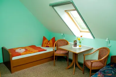 Ein Bett oder Betten in einem Zimmer der Unterkunft Christel's Pension