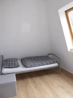 Ein Bett oder Betten in einem Zimmer der Unterkunft App. Weisses Haus