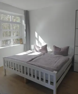 Ein Bett oder Betten in einem Zimmer der Unterkunft App. Weisses Haus