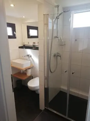 Ein Badezimmer in der Unterkunft Haus Andrea