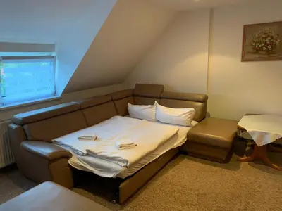 Ein Bett oder Betten in einem Zimmer der Unterkunft Hotel & Restaurant Schenk von Landsberg