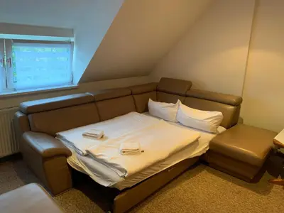 Ein Bett oder Betten in einem Zimmer der Unterkunft Hotel & Restaurant Schenk von Landsberg