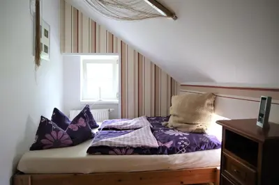 Ein Bett oder Betten in einem Zimmer der Unterkunft Altes Gärtnerhaus