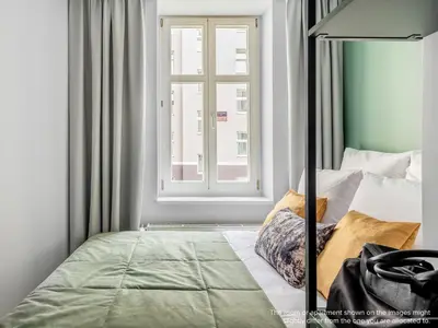 Ein Bett oder Betten in einem Zimmer der Unterkunft Numa Berlin Kater