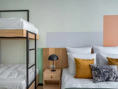 Ein Bett oder Betten in einem Zimmer der Unterkunft Numa Berlin Kater