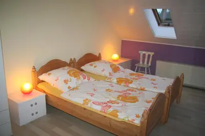 Ein Bett oder Betten in einem Zimmer der Unterkunft Buntspecht Logis