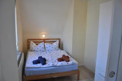 Ein Bett oder Betten in einem Zimmer der Unterkunft Buntspecht Logis