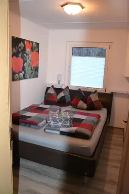 Ein Bett oder Betten in einem Zimmer der Unterkunft Ferienhaus am Birkenwaeldchen - Motzener See 150m