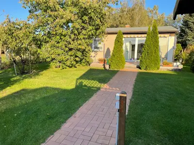 Ein Garten an der Unterkunft Ferienhaus am Birkenwaeldchen - Motzener See 150m