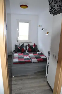 Ein Bett oder Betten in einem Zimmer der Unterkunft Ferienhaus am Birkenwaeldchen - Motzener See 150m