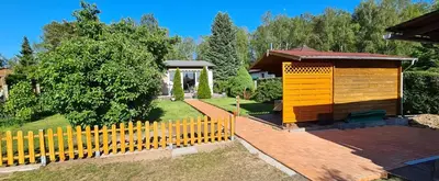Ein Garten an der Unterkunft Ferienhaus am Birkenwaeldchen - Motzener See 150m