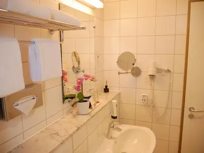 Ein Badezimmer in der Unterkunft Parkhotel Marzahn