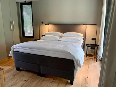 Ein Bett oder Betten in einem Zimmer der Unterkunft Bungalow im Wald