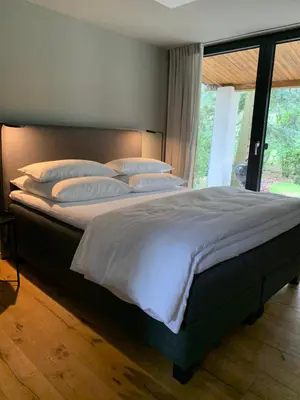 Ein Bett oder Betten in einem Zimmer der Unterkunft Bungalow im Wald