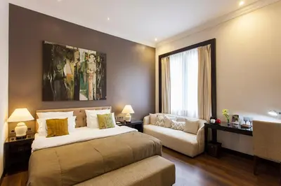 Ein Bett oder Betten in einem Zimmer der Unterkunft Quentin Boutique Hotel
