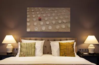 Ein Bett oder Betten in einem Zimmer der Unterkunft Quentin Boutique Hotel