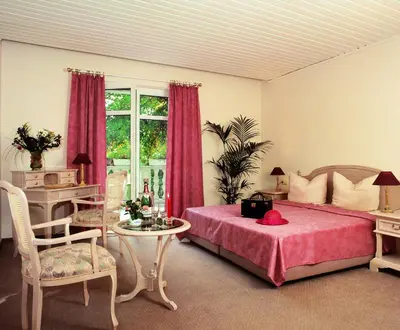 Ein Bett oder Betten in einem Zimmer der Unterkunft Hammers Landhotel GmbH