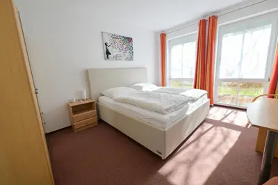 Ein Bett oder Betten in einem Zimmer der Unterkunft Schwalbenflug 1 Berlin
