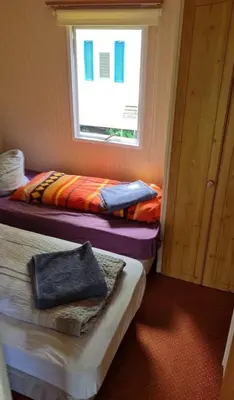 Ein Bett oder Betten in einem Zimmer der Unterkunft Ferienpark am Hellsee