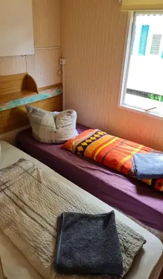 Ein Bett oder Betten in einem Zimmer der Unterkunft Ferienpark am Hellsee