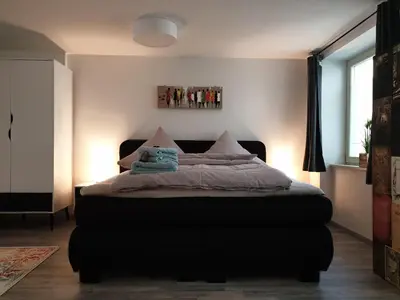 Ein Bett oder Betten in einem Zimmer der Unterkunft Studioapartment L46 - in exklusiver Innenstadtlage