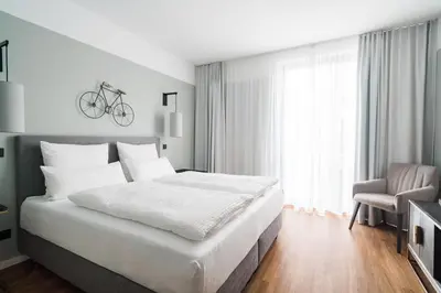 Ein Bett oder Betten in einem Zimmer der Unterkunft Velotel Bad Saarow