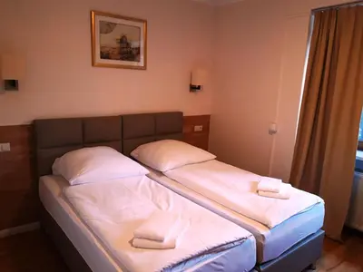 Ein Bett oder Betten in einem Zimmer der Unterkunft LV Rooms & Apartments am Lützowplatz