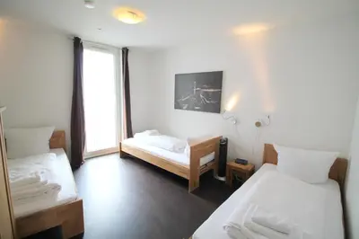 Ein Bett oder Betten in einem Zimmer der Unterkunft Holiday at Alexanderplatz Apartments
