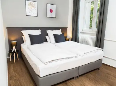 Ein Bett oder Betten in einem Zimmer der Unterkunft BENSIMON apartments Charlottenburg