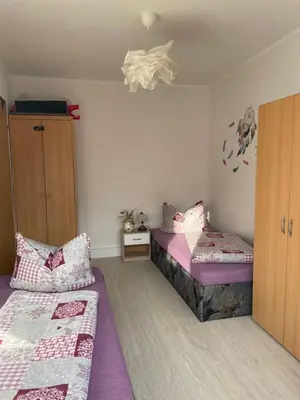 Ein Bett oder Betten in einem Zimmer der Unterkunft Ferienwohnung Sonnenberg Dahmeblick