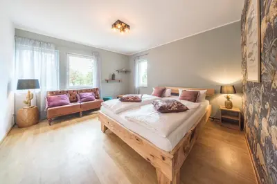 Ein Bett oder Betten in einem Zimmer der Unterkunft Design Apartments - 