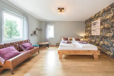 Ein Bett oder Betten in einem Zimmer der Unterkunft Design Apartments - 