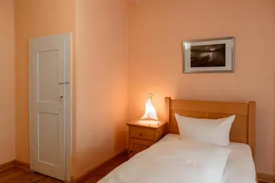 Ein Bett oder Betten in einem Zimmer der Unterkunft Klosterhotel Lehnin