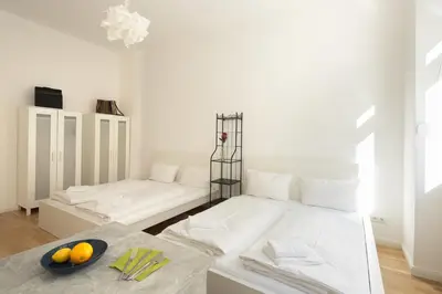 Ein Bett oder Betten in einem Zimmer der Unterkunft Newton-Appartement mit 3 Schlafzimmern