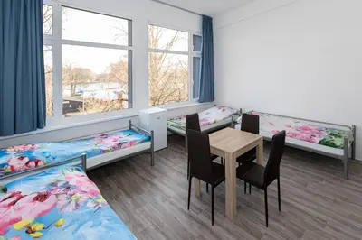 Ein Bett oder Betten in einem Zimmer der Unterkunft NeoHostel