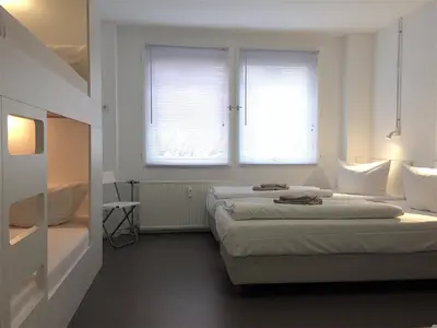 Ein Bett oder Betten in einem Zimmer der Unterkunft Apartment&Rooms near Brandenburg Gate