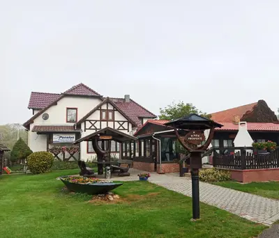 Ein Garten an der Unterkunft Pension Haus zum See GbR