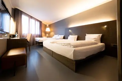 Ein Bett oder Betten in einem Zimmer der Unterkunft GINN Hotel Berlin Potsdam