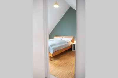 Ein Bett oder Betten in einem Zimmer der Unterkunft Charmante, ruhige Ferienwohnung mit Balkon