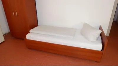Ein Bett oder Betten in einem Zimmer der Unterkunft Hostel am Kurtti